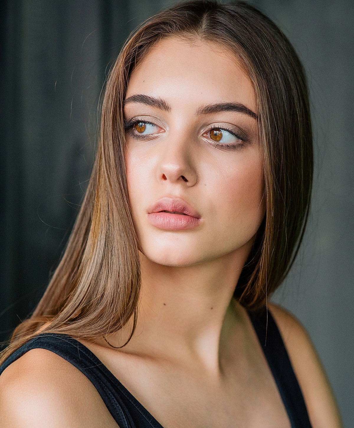 Portrait of a young woman with long hair.