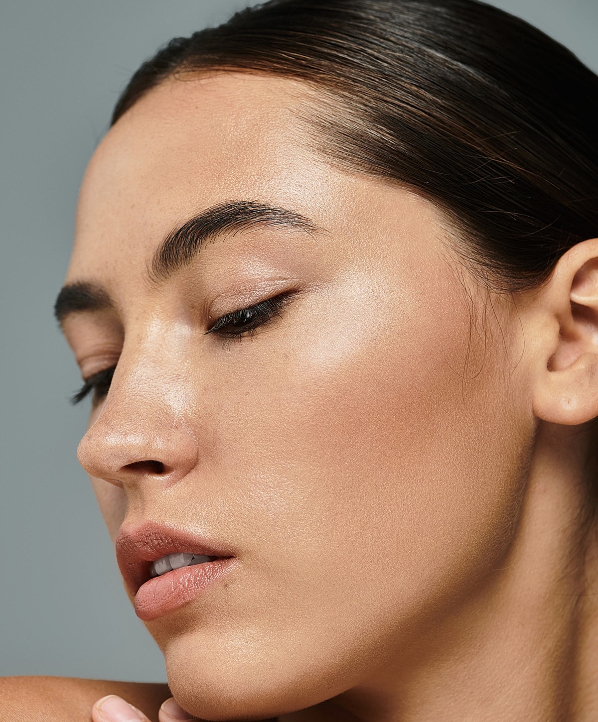 Close-up of a woman's face with smooth skin.