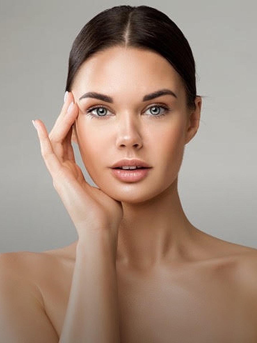 Woman with flawless skin and natural makeup.