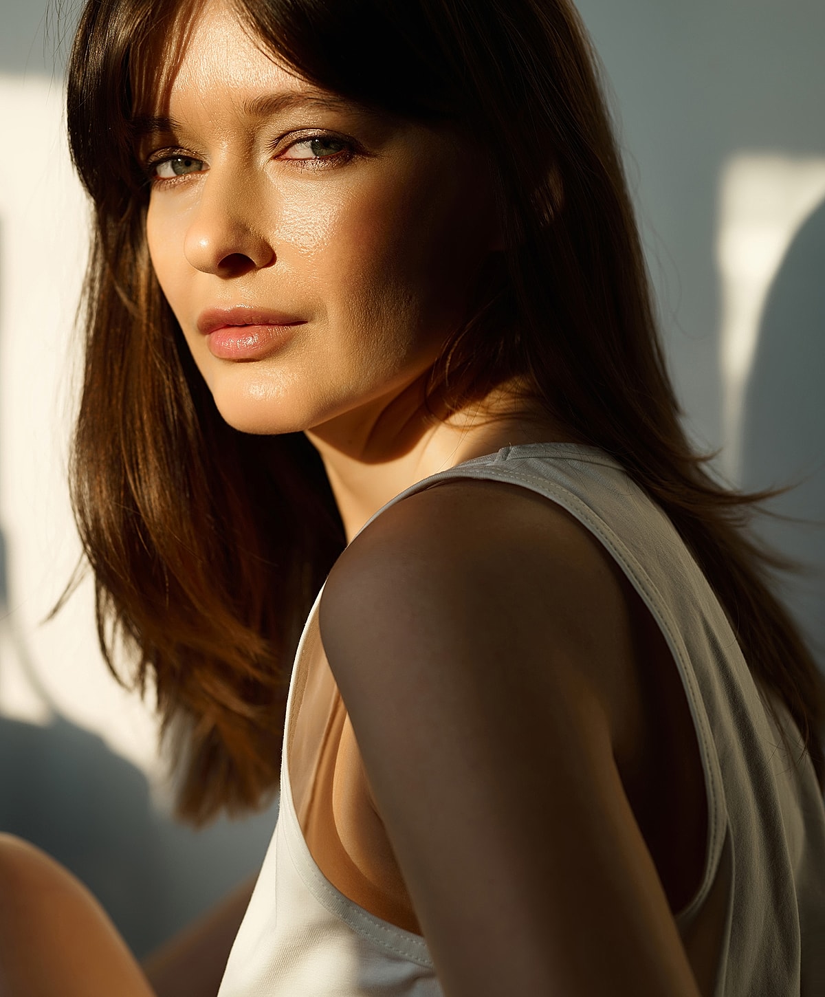 Woman with long hair in natural light.