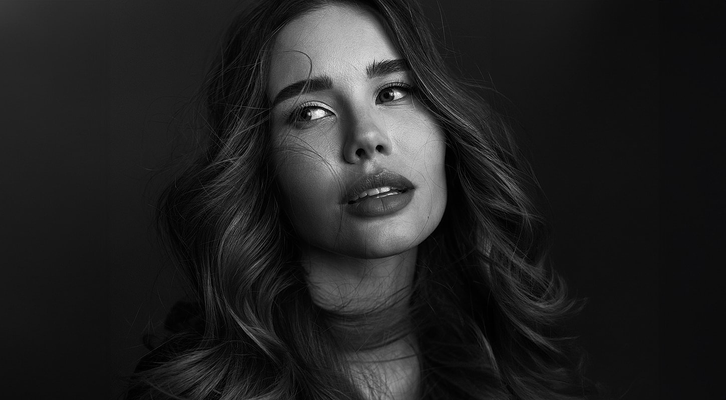 Black and white portrait of a woman with waves.