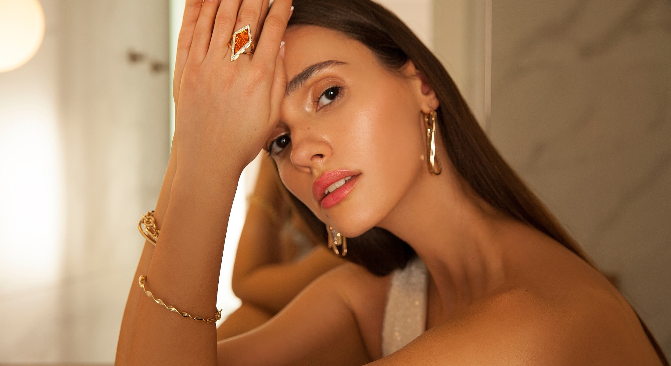 Model showcasing elegant jewelry accessories.